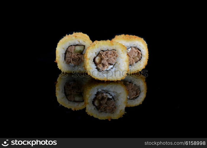 sushi with salmon on black background