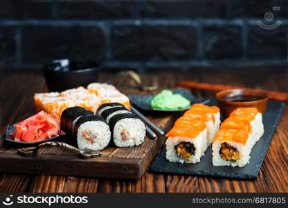 sushi with wasabi and ginger on a table