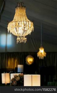 Suspended chandelier as interior decor at corporate gala dinner or event party