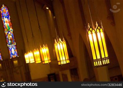 Suspended lights inside church.