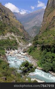 Suspension brdge and mountain river in Nepal