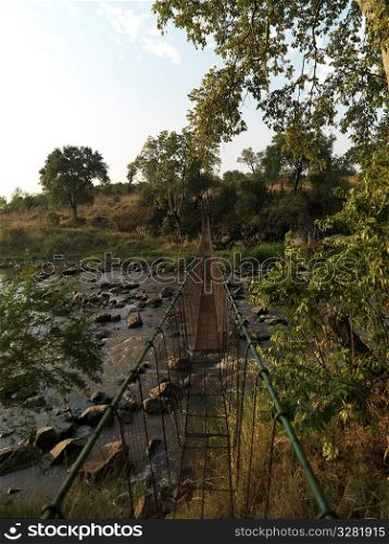 Suspension bridge and stream Kenya Africa