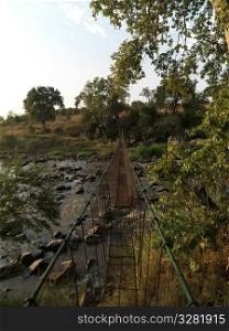 Suspension bridge and stream Kenya Africa