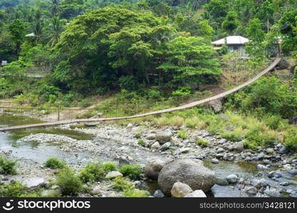 Suspension bridge in a small village. Cordillera mountains, Philippines