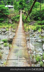 Suspension bridge in a small village. Cordillera mountains, Philippines