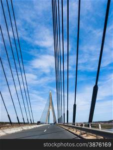 Suspension bridge over the river between Spain and Portugal. Bridge over the Guadiana River in Ayamonte