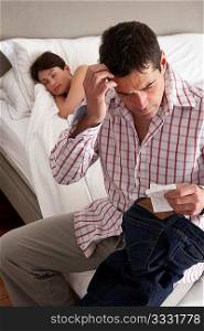 Suspicious Husband Finding Receipt In Wife&acute;s Pocket Whilst She Sleeps