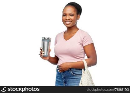 sustainability and people concept - happy african american woman with thermo cup or tumbler for hot drinks and food in string bag over white background. woman with tumbler and food in string bag