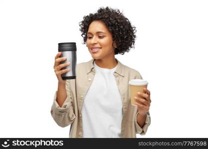 sustainability and people concept - portrait of happy smiling woman with coffee cup and tumbler for hot drinks over white background. woman with coffee cup and tumbler for hot drinks