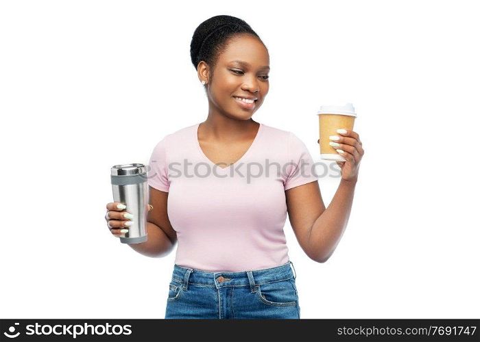 sustainability and people concept - portrait of happy smiling young african american woman with coffee cup and tumbler for hot drinks over white background. woman with coffee cup and tumbler for hot drinks