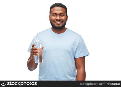 sustainability, consumerism and eco friendly concept - happy smiling african american man with water in reusable glass bottle over white background. happy african man with water in glass bottle