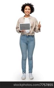 sustainable energy, power and sustainability concept - happy smiling woman with solar battery model showing thumbs up over white background. happy woman with solar battery showing thumbs up