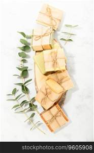 Sustainable lifestyle concept. Bars of natural handmade soap and ingredients on marble background, top view 