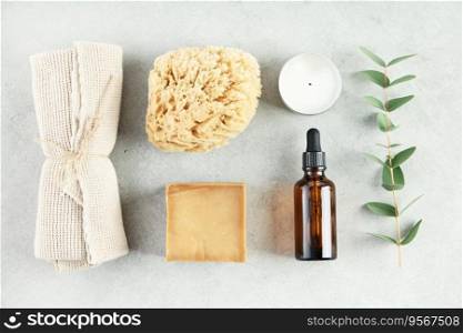 Sustainable lifestyle concept. Top view photo of natural hand made soap bar and eco friendly personal care products on grey background