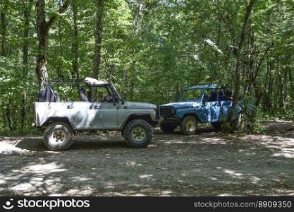 SUV in the forest. Transport for hilly and mountainous terrain. Russian off-road vehicle.. Shapsugskaya, Russia - June 30, 2017  SUV in the forest. Transport for hilly and mountainous terrain. Russian off-road vehicle.