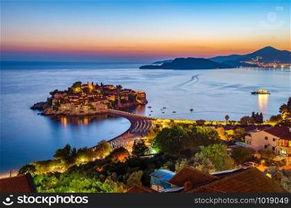Sveti Stefan island in Montenegro, sunset on the seacoast. Popular travel destination