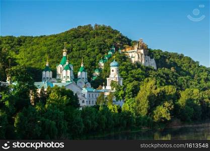 Svyatogorsk, Ukraine 07.16.2020.  Panoramic view of the Holy Mountains Lavra of the Holy Dormition in Svyatogorsk or Sviatohirsk, Ukraine, on a sunny summer morning. The Holy Mountains Lavra in Svyatogorsk, Ukraine