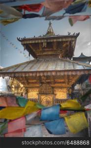 Swayambhunath - the Buddhist temple and the village center on the outskirts of Kathmandu in Nepal. Monkey Temple.. Swayambhunath