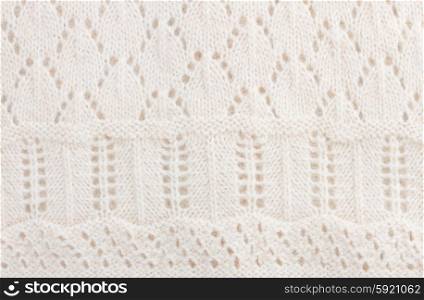 sweater background. texture of white knitted soft sweater background