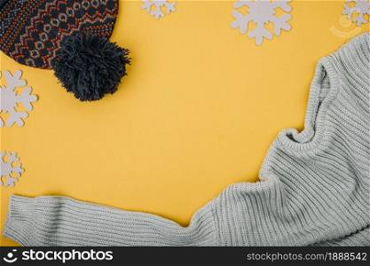 sweater bobble hat near snowflakes. Resolution and high quality beautiful photo. sweater bobble hat near snowflakes. High quality and resolution beautiful photo concept