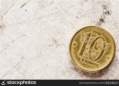 Swedish Coin - Ten Kronor on the canvas background with copy-space