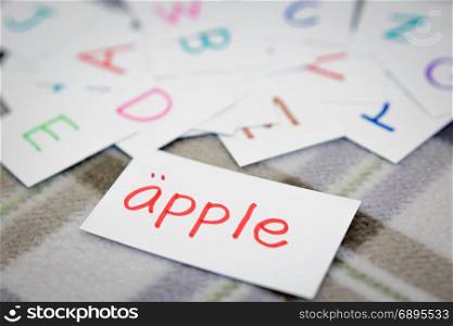 Swedish; Learning the New Word with the Alphabet Cards; Writing APPLE