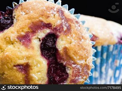 sweet and delicious muffins with whole cherries inside, close-up of food and desserts, homemade cakes. muffins with whole cherries