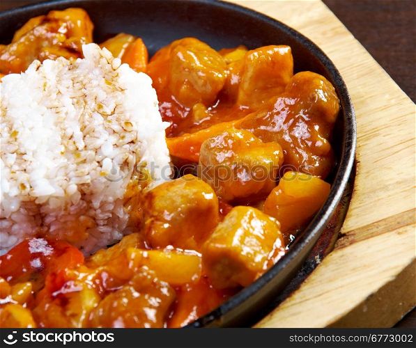 Sweet and sour pork meat with rice