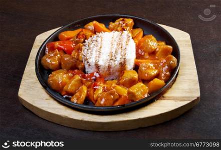 Sweet and sour pork meat with rice