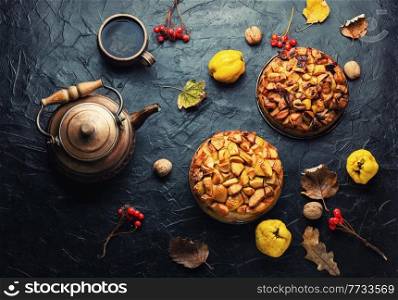 Sweet autumn pie or cake with quince and apple. Autumn pie with quince