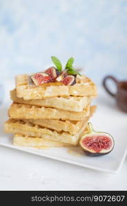 sweet breakfast Belgian waffles with honey and figs