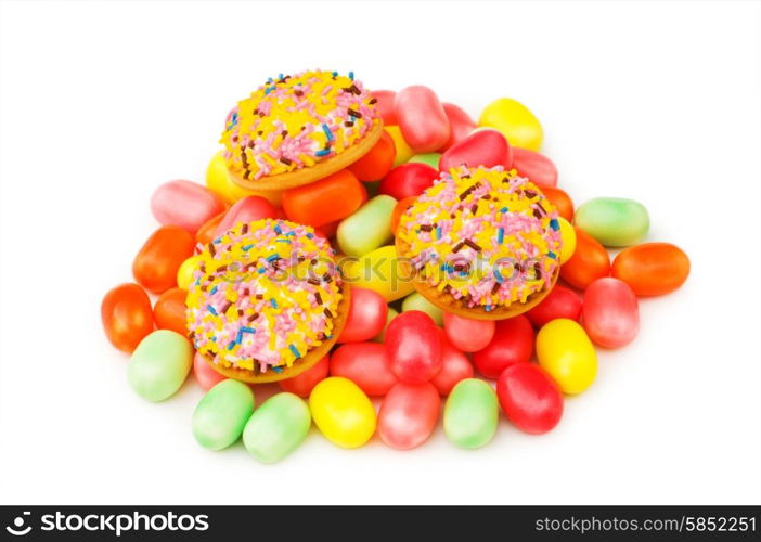 Sweet cakes and colourful gums at the background