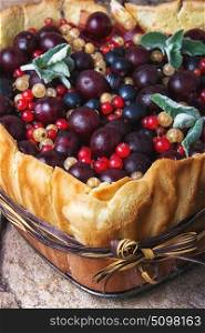 Sweet cakes with berries. Rustic berry summer pie. Pie with cherry, currant, raspberry filling