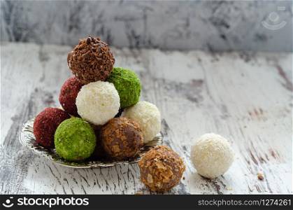 Sweet chocolate truffles on the white background