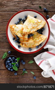 Sweet crepes filled with fresh blueberry