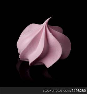 Sweet cripsy pink meringue isolated on black with reflection.