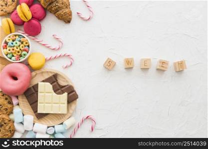 sweet cubic blocks near unhealthy food white backdrop