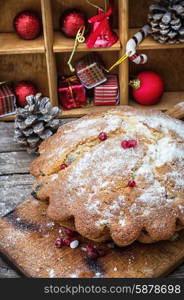 Sweet cupcake baked for the new year holiday on wooden table on background of Christmas decorations.Photo tinted.