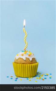 sweet cupcake with lit candle