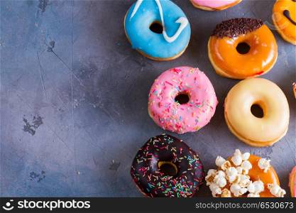 sweet doughnuts on gray stone background. sweet doughnuts on gray stone background with copy space