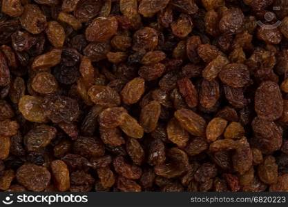 Sweet dry raisins close up shot for background