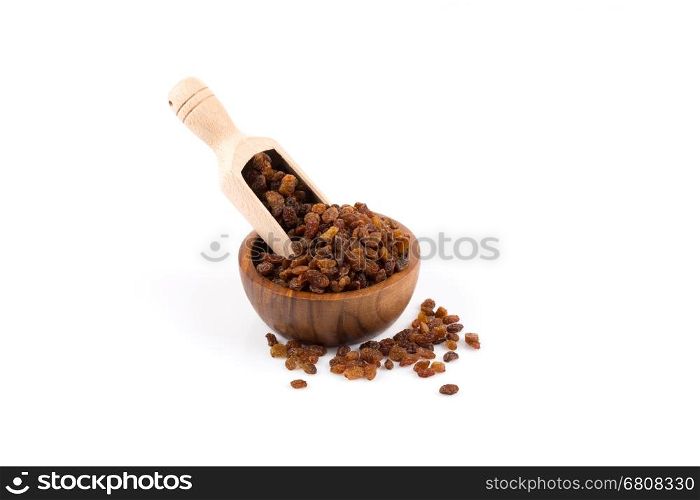 Sweet dry raisins in bowl and scoop isolated on the white background
