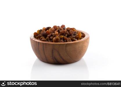 Sweet dry raisins in bowl isolated on the white background