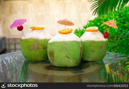 Sweet green coconuts water with drinking