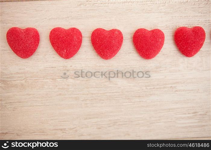 Sweet hearts on a gray wooden background
