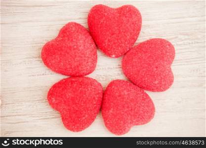 Sweet hearts on a gray wooden background