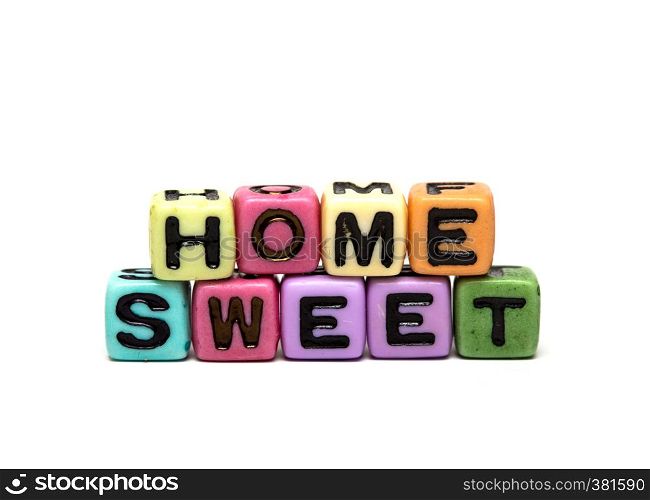 sweet home - word made from multicolored child toy cubes with letters
