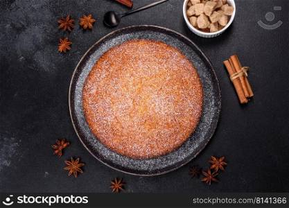 Sweet Homemade Thanksgiving Pumpkin Pie Ready to Eat. Pumpkin pie on marble cutting board. Dark background. Copy space