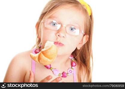 sweet little baby girl eating bread isolated on white