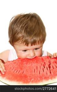 Sweet little girl eating a slice of watermelon on white background